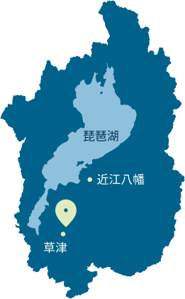 滋賀県が切り抜かれた草津第一ホテルの場所にピンを指した地図